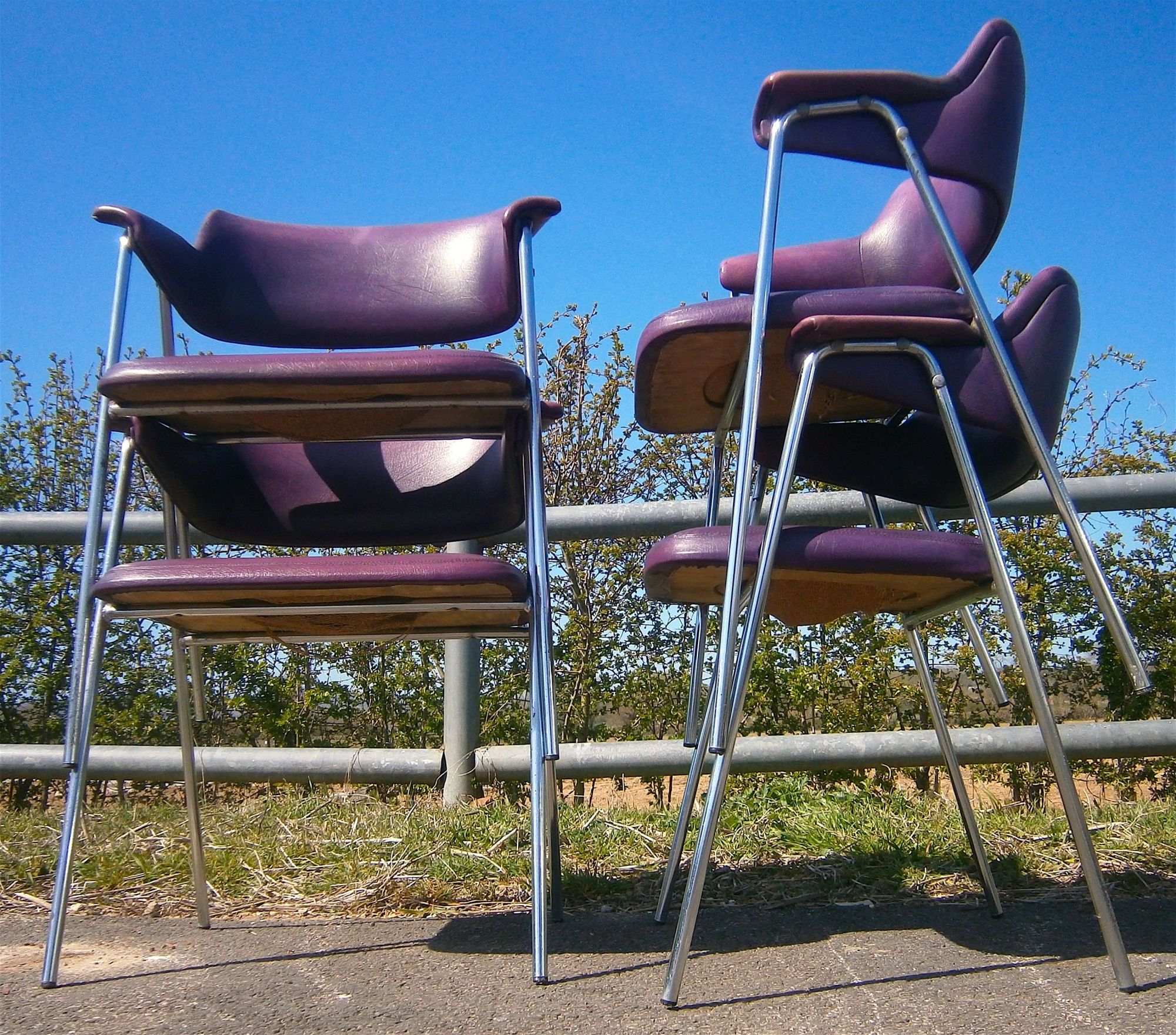 A set of four 1960s chrome framed Pel style elbow chairs